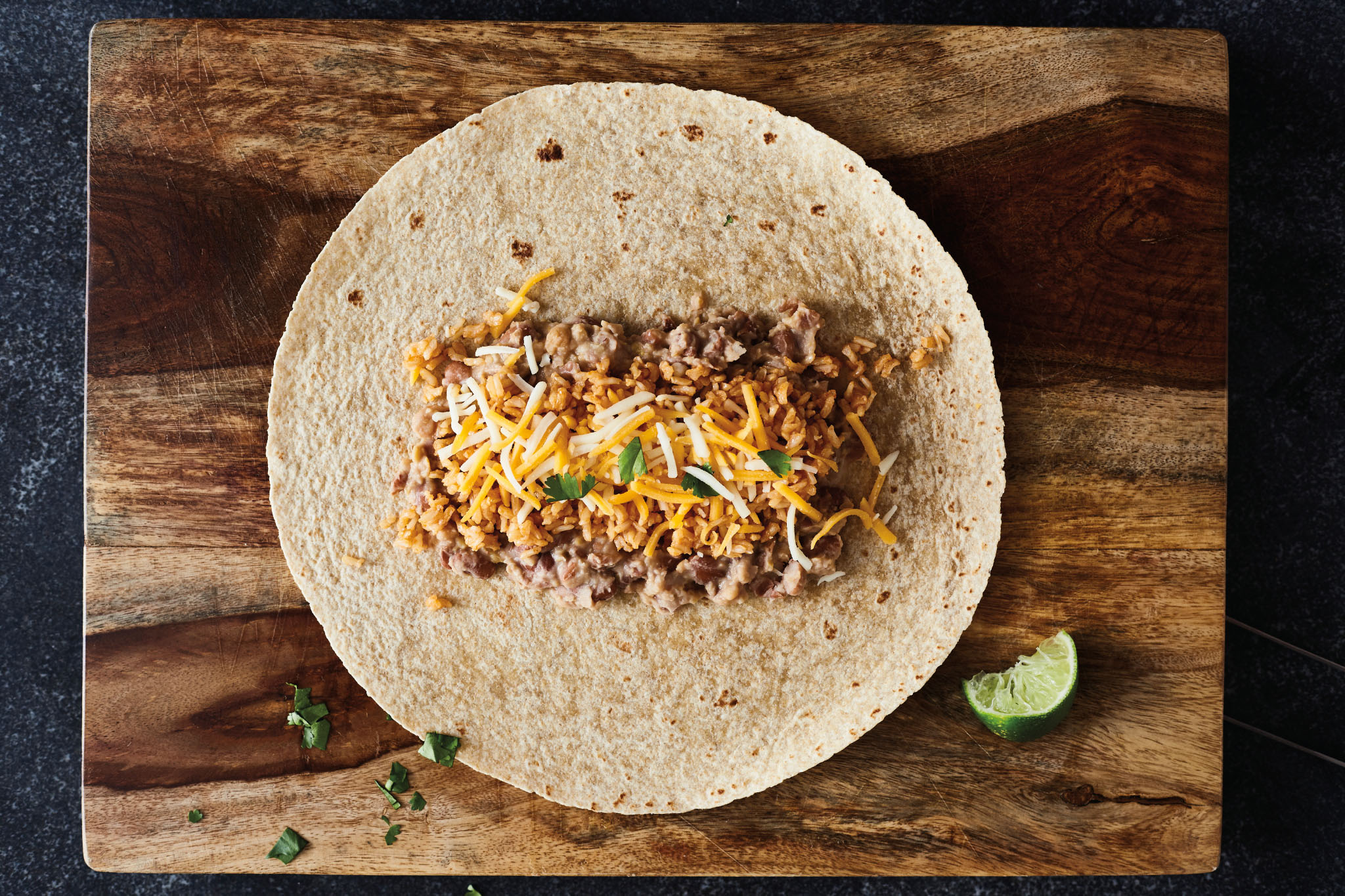 An image for the recipe to make bean, rice, and cheese burritos.