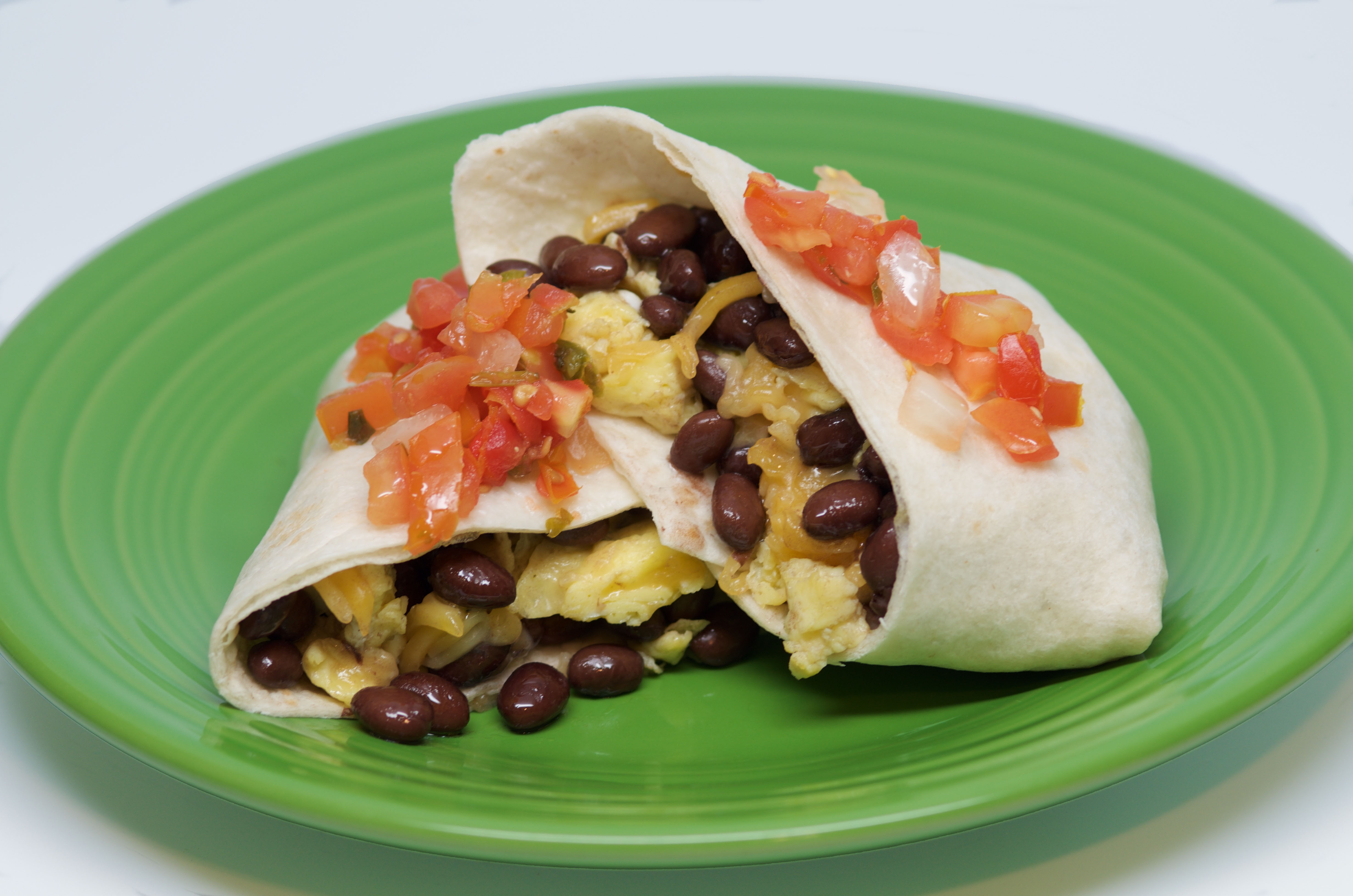An image depicting the breakfast bean burrito with eggs recipe