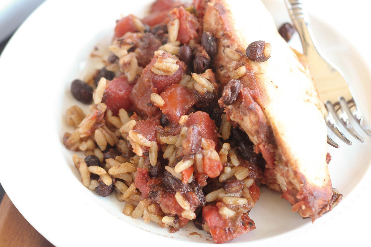 An image showcasing the New Orleans Black Beans and Rice Chicken
