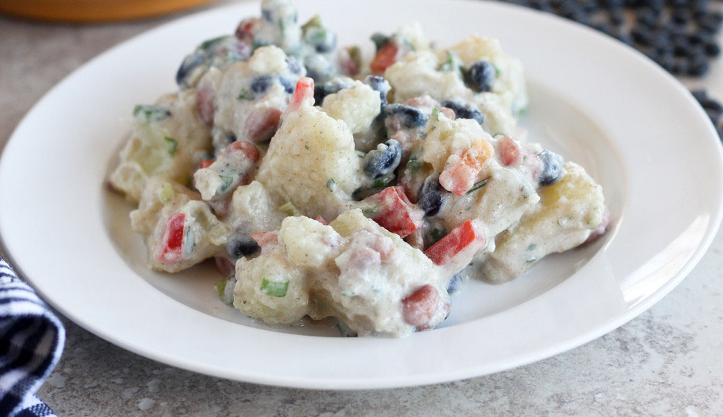 An image depicting the Potato Salad with Black Beans recipe brought to you by the Bean Institute.